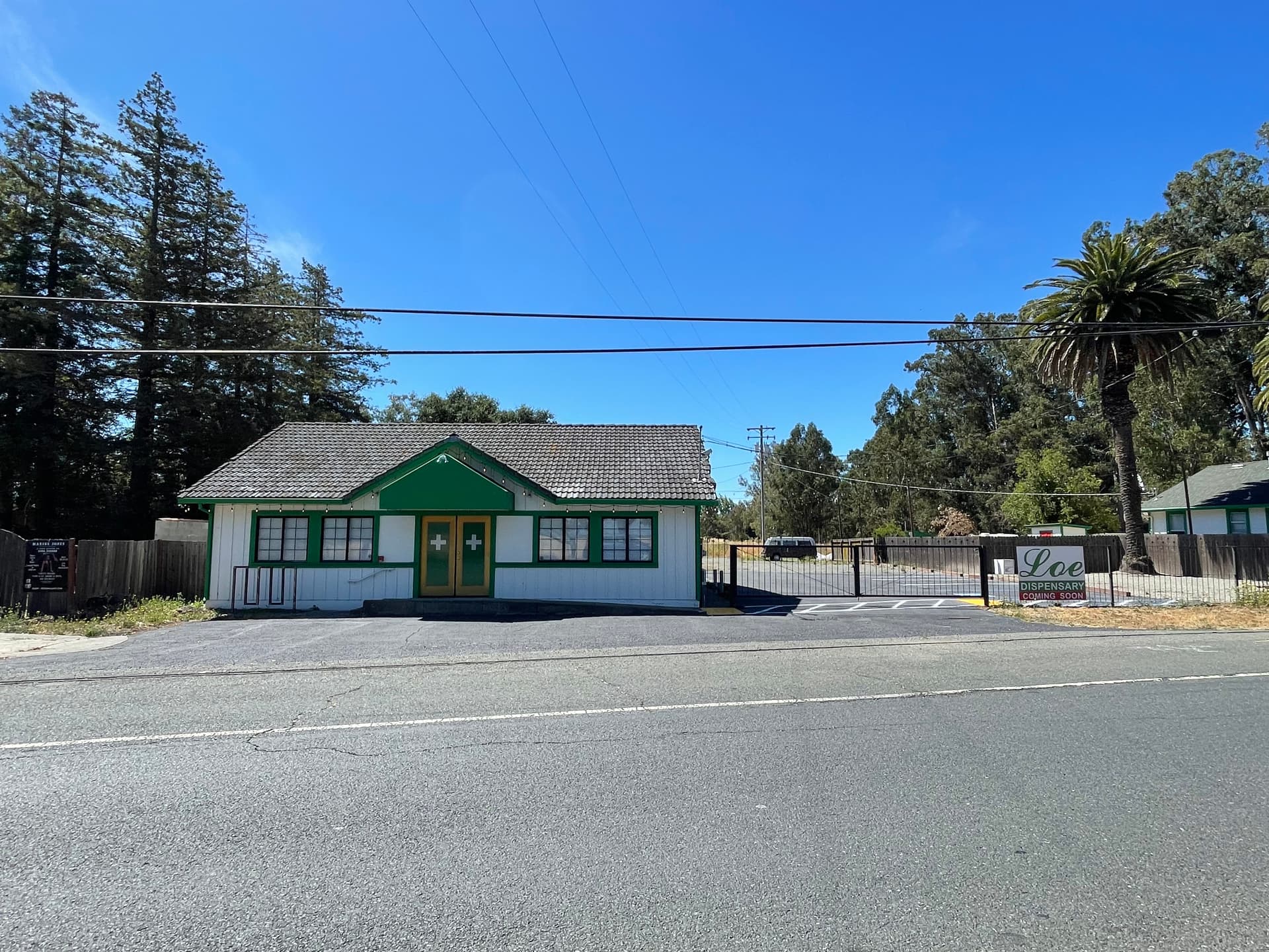 Cannabis dispensary storefront in California with a coming-soon sign
