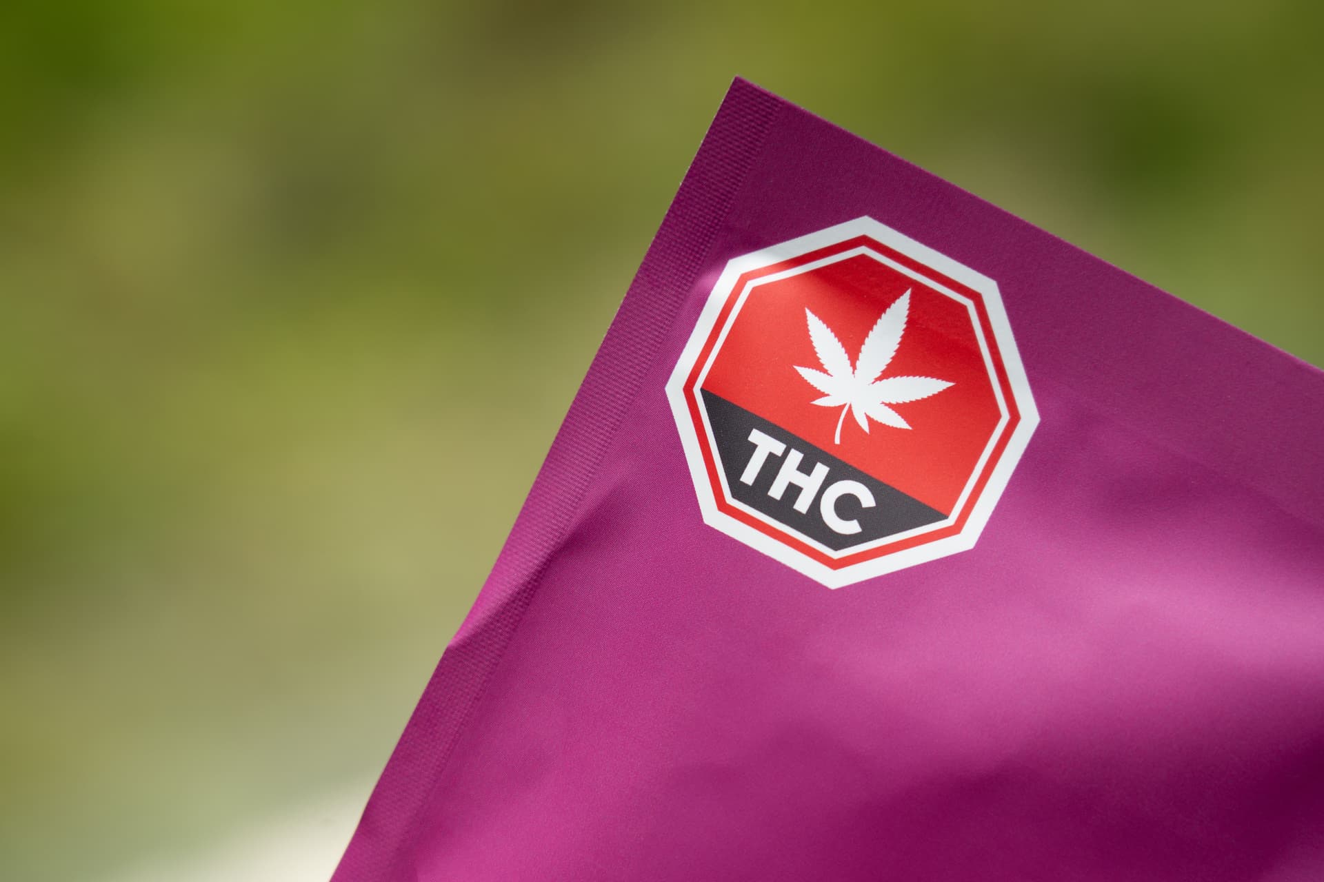 Cannabis package carrying a prominent THC warning label