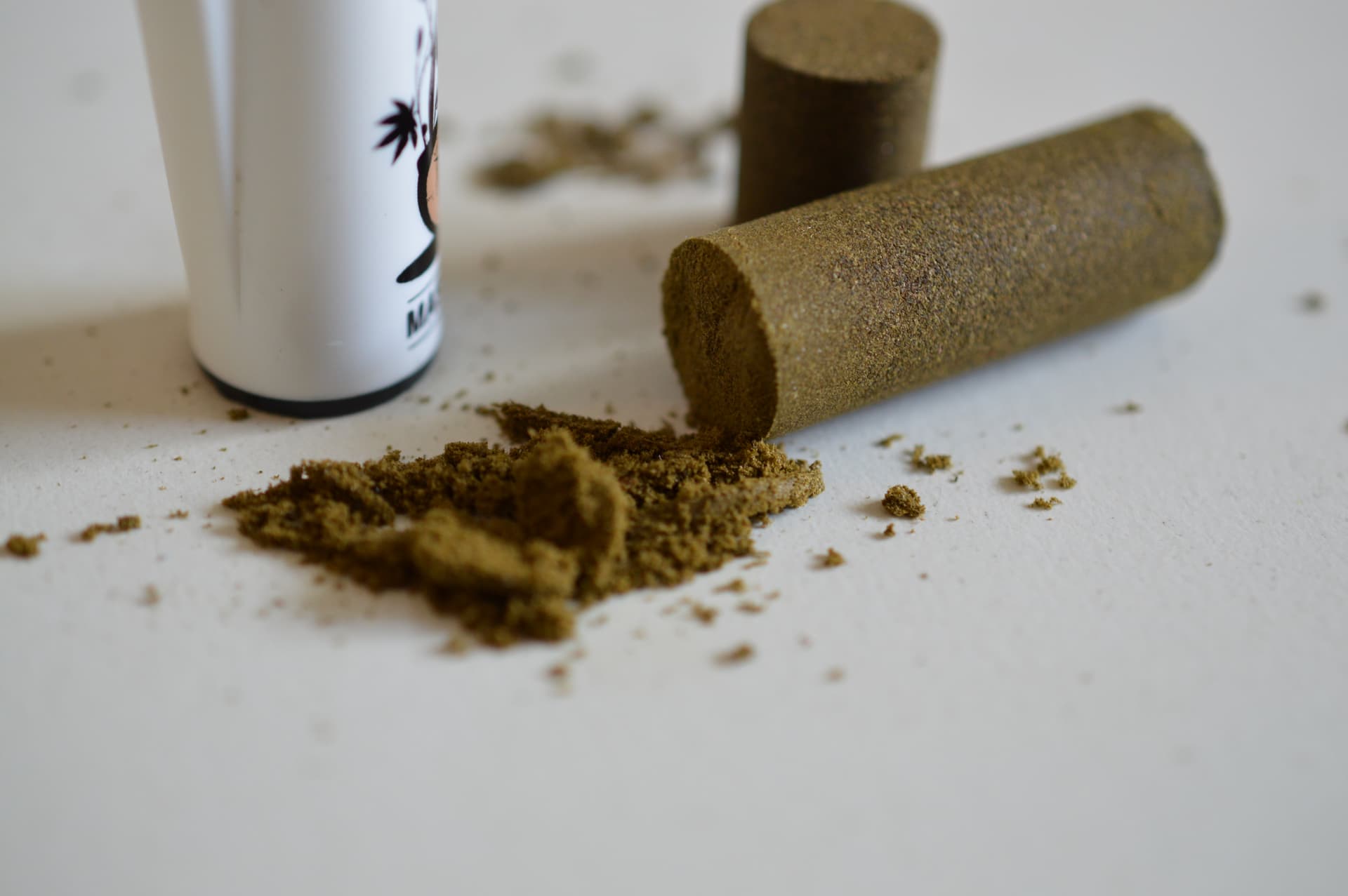 Pressed blocks and loose particles of dry-sieve cannabis hash